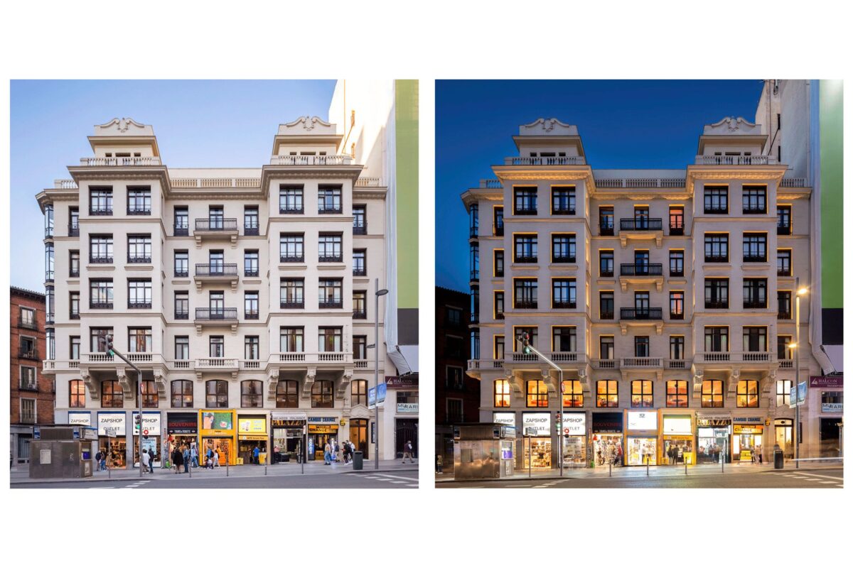 fachada edificio historico en gran via madrid con luz diurna y luz nocturna